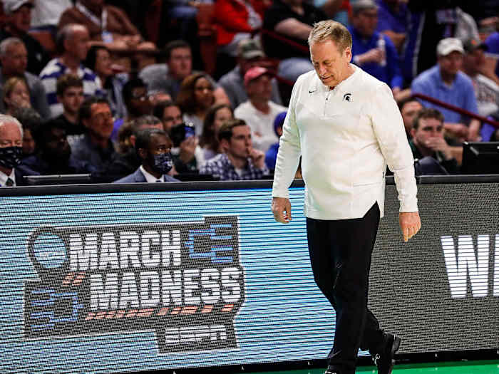 Tom Izzo looks down while pacing the sideline